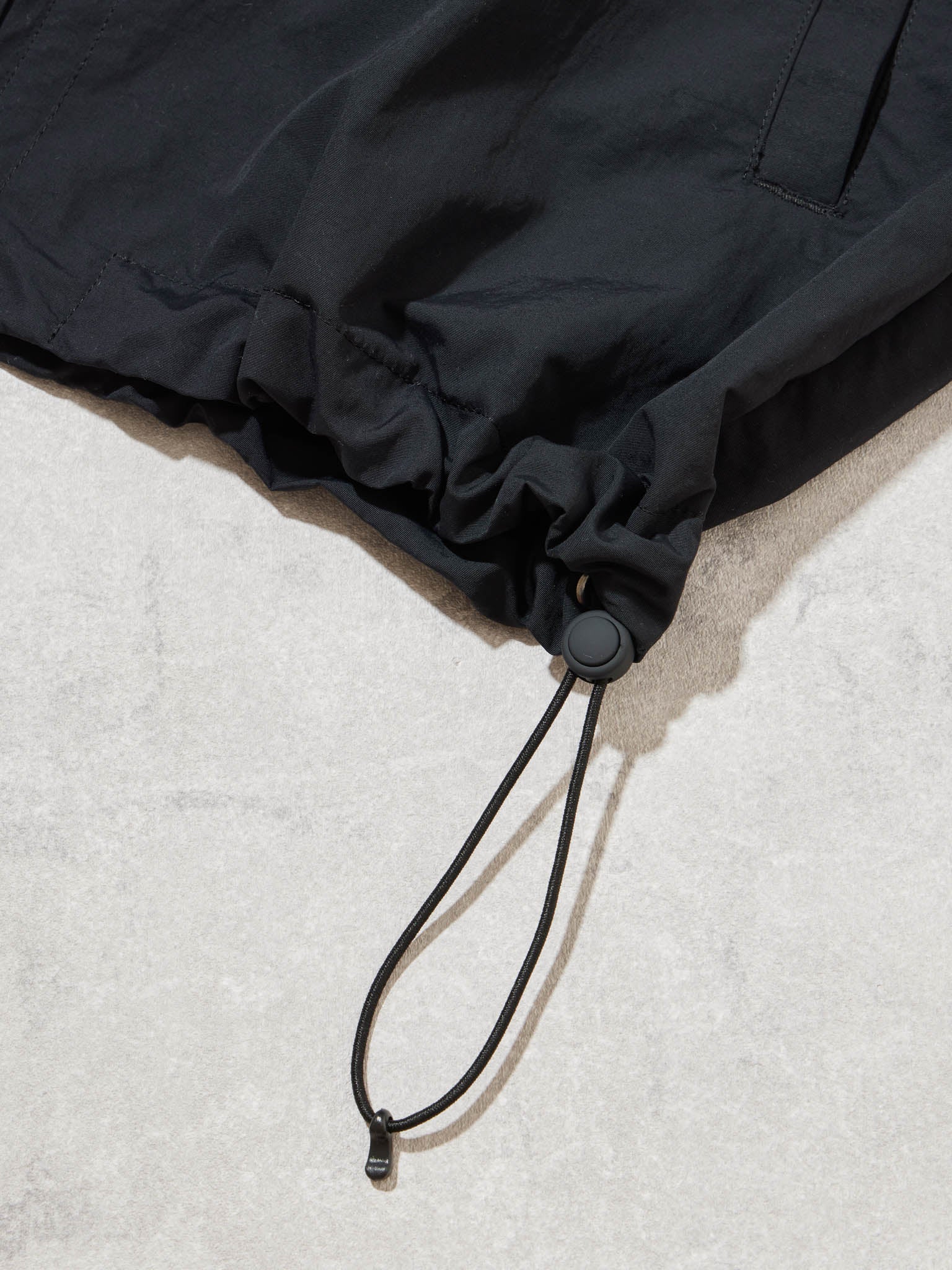BAGLESS DRAWSTRING BLOUSON